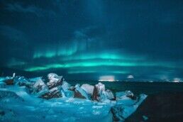 Northern Lights over a glacier lagoon in Iceland