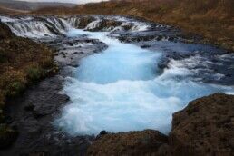 An aerial shot of Brúarfoss waterfall