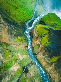 A wide aerial shot over a river in South Iceland