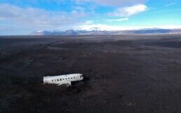 The plane wreck in Iceland is surrounded by black sand desert