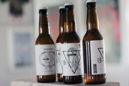 Photos of four bottles of the beer First Lady by Lady Brewery