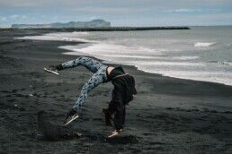 woman in the black sand beach in Iceland