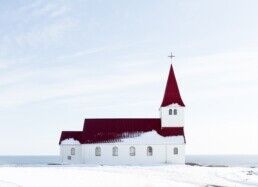 rural church during snow in Iceland