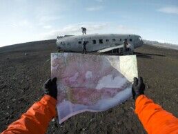 person holding a map in iceland