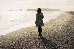 lady standing by the beach in Iceland